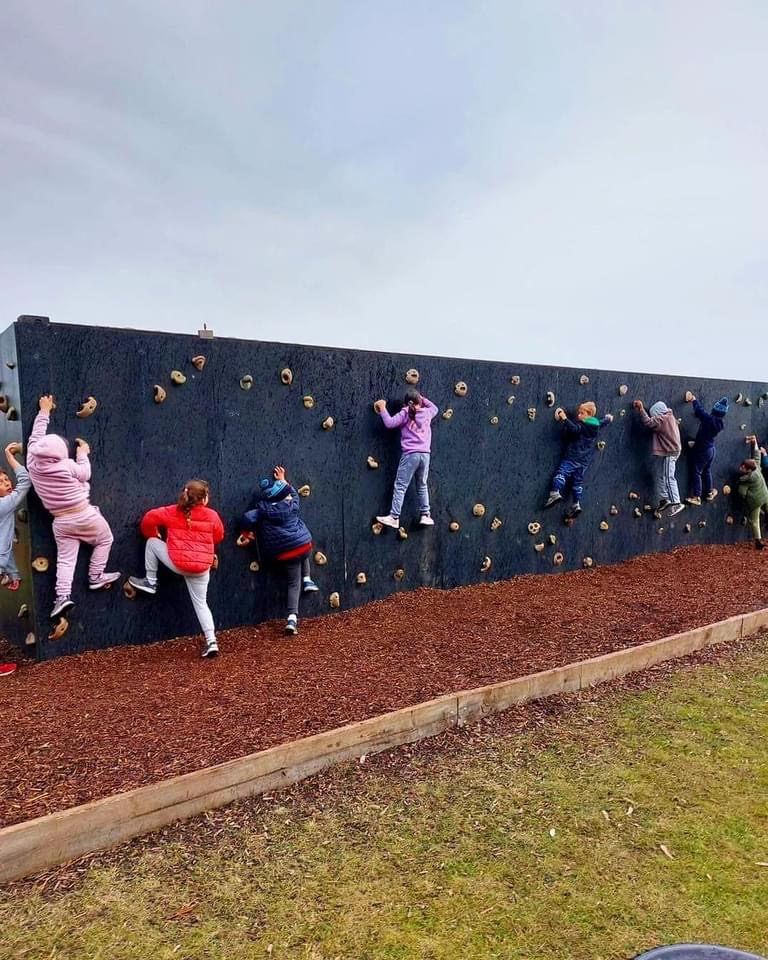 Children climbing the bouldering wall at Sunnystones