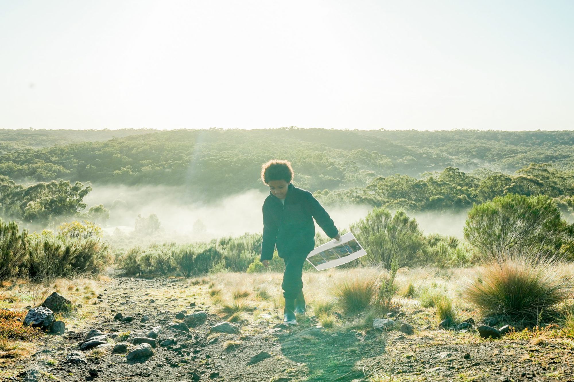 A student roaming the misty bushland during the Survival Game