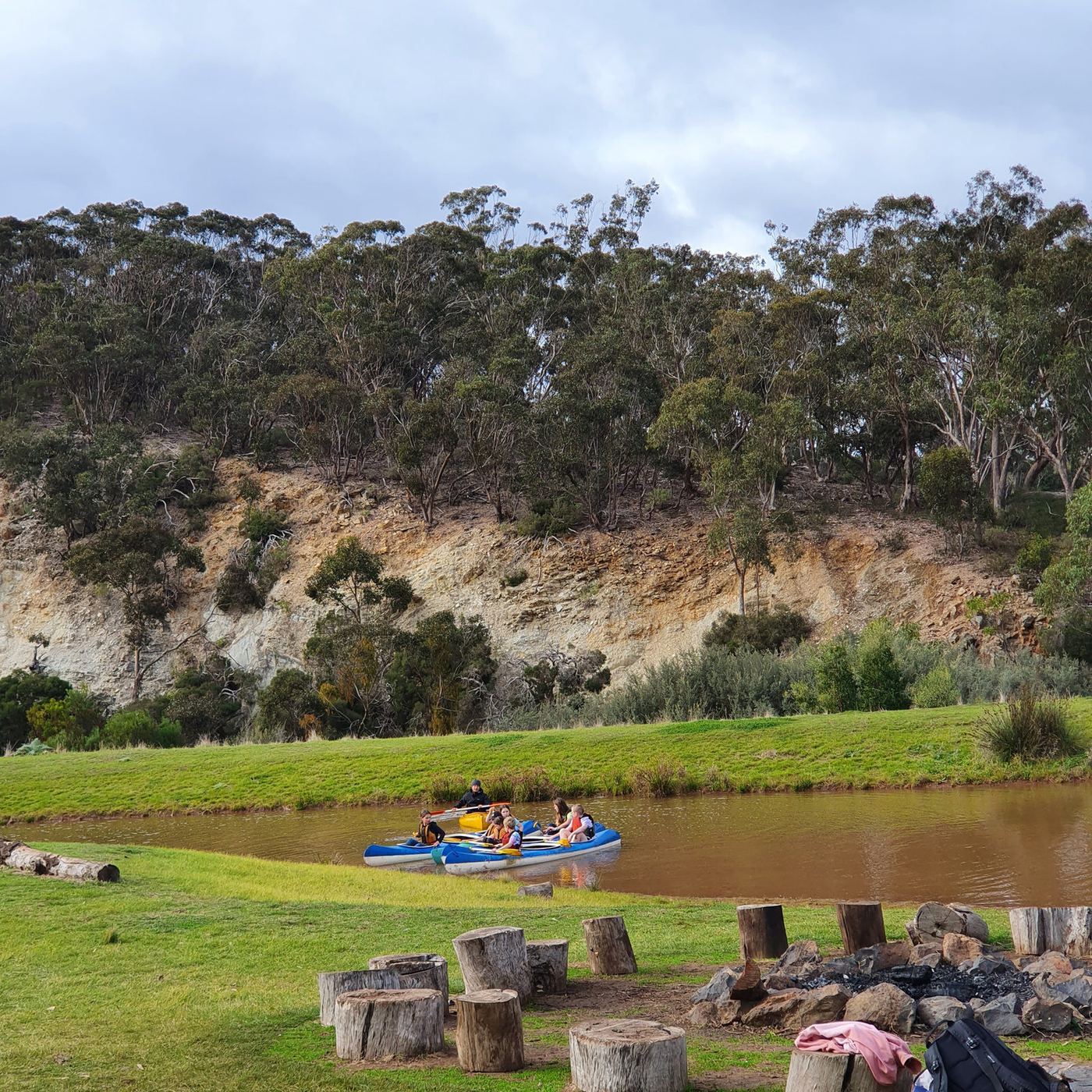 Canoes on the dam beneath the white cliffs
