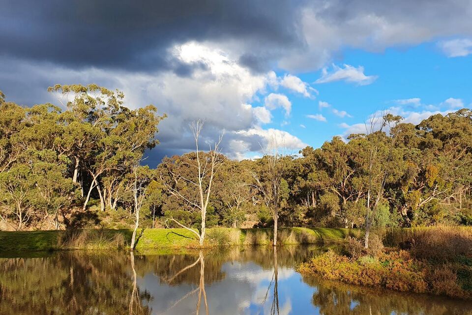 The dam reflecting a dramatic sky