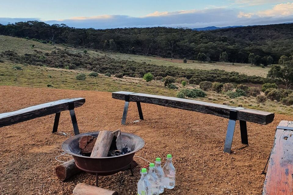 Fire pit and benches looking over the valley