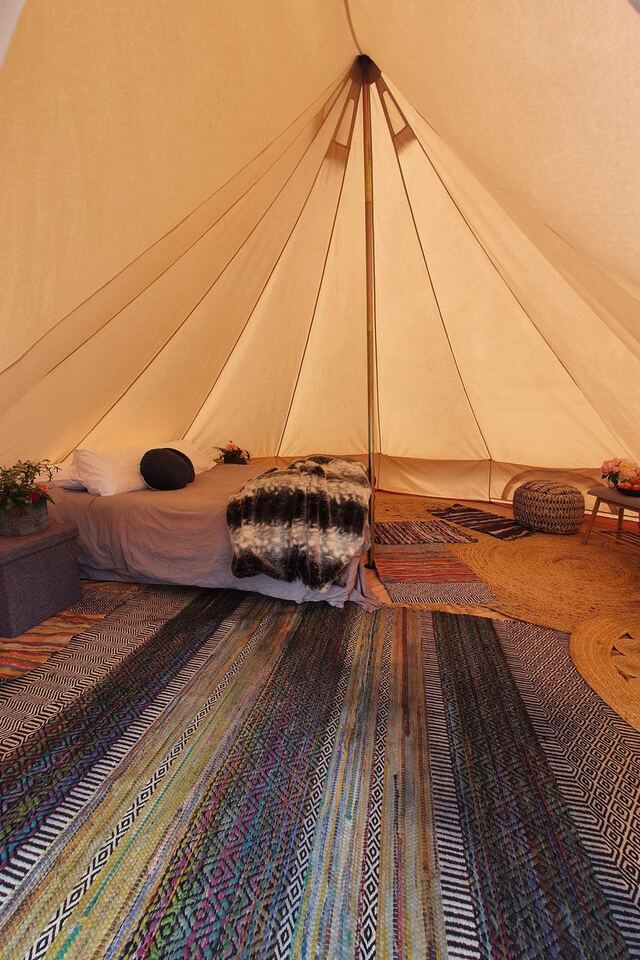 Inside a furnished glamping bell tent