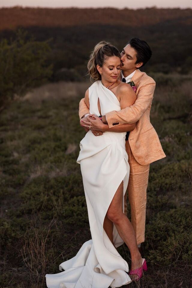 A couple embracing in the paddock