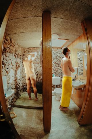 A candid fisheye photo of guests in the homestead bathroom