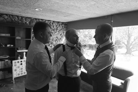 The groom and groomsmen getting ready together before the ceremony