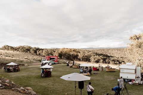 A wide view of the property with the reception marquee set up in the distance