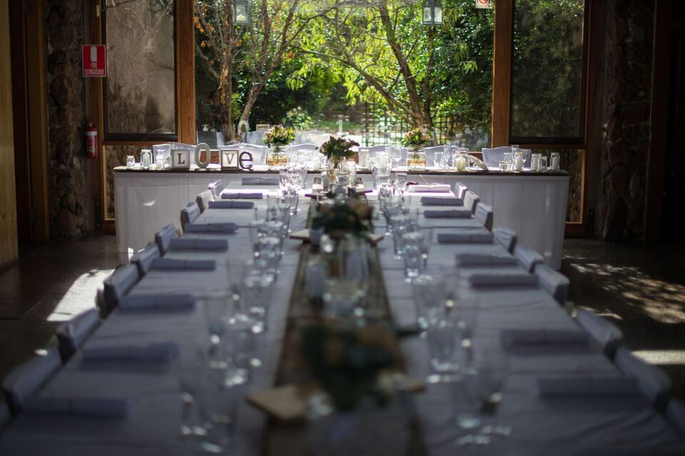 Long table styled for the reception in the homestead hall